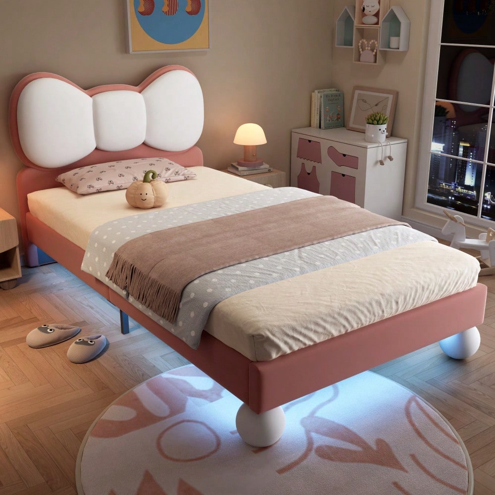 Polsterbett, Einzelbett, Kinderbett, Fliegeformiges Bettkopfteil, Farblich anpassbare LED-Lichtleiste unter dem Bett, stabiler Lattenrost, Samt, schönes Design, Beige + Rosa, 90x200cm