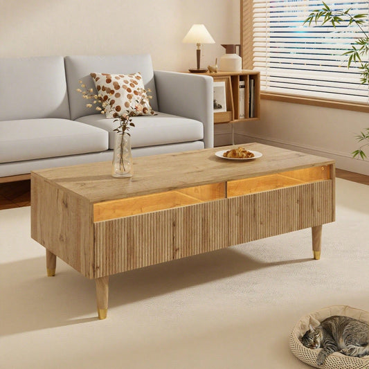 Dieser moderne LED-Couchtisch verfügt über eine gewellte Schubladenplatte, gold-holzfarbene Beine, zwei Schubladen und einen farbwechselnden LED-Lichtstreifen