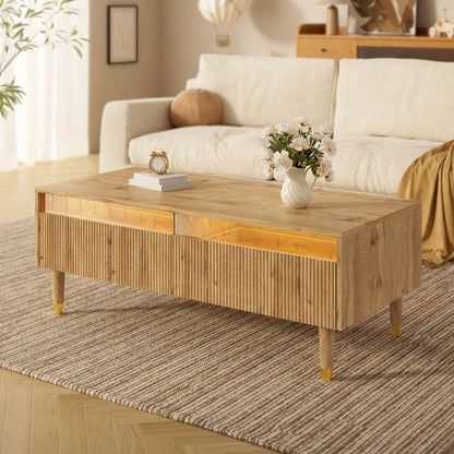 Dieser moderne LED-Couchtisch verfügt über eine gewellte Schubladenplatte, gold-holzfarbene Beine, zwei Schubladen und einen farbwechselnden LED-Lichtstreifen