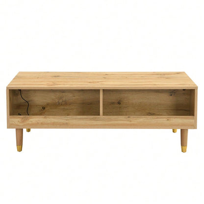 Dieser moderne LED-Couchtisch verfügt über eine gewellte Schubladenplatte, gold-holzfarbene Beine, zwei Schubladen und einen farbwechselnden LED-Lichtstreifen