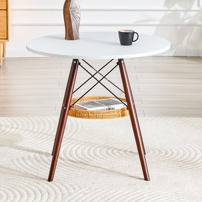 Runder Esstisch Ø 80 cm,Tischplatte aus weißem MDF, Tischbeine aus walnussfarbenem Massivholz, kombiniert mit einer schwebenden, geflochtenen Ablagekorbkonstruktion, geeignet für 2 bis 4 Personen.